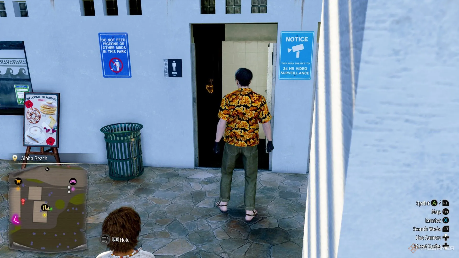 Majima outside a restoom in Like a Dragon Pirate Yakuza in Hawaii.